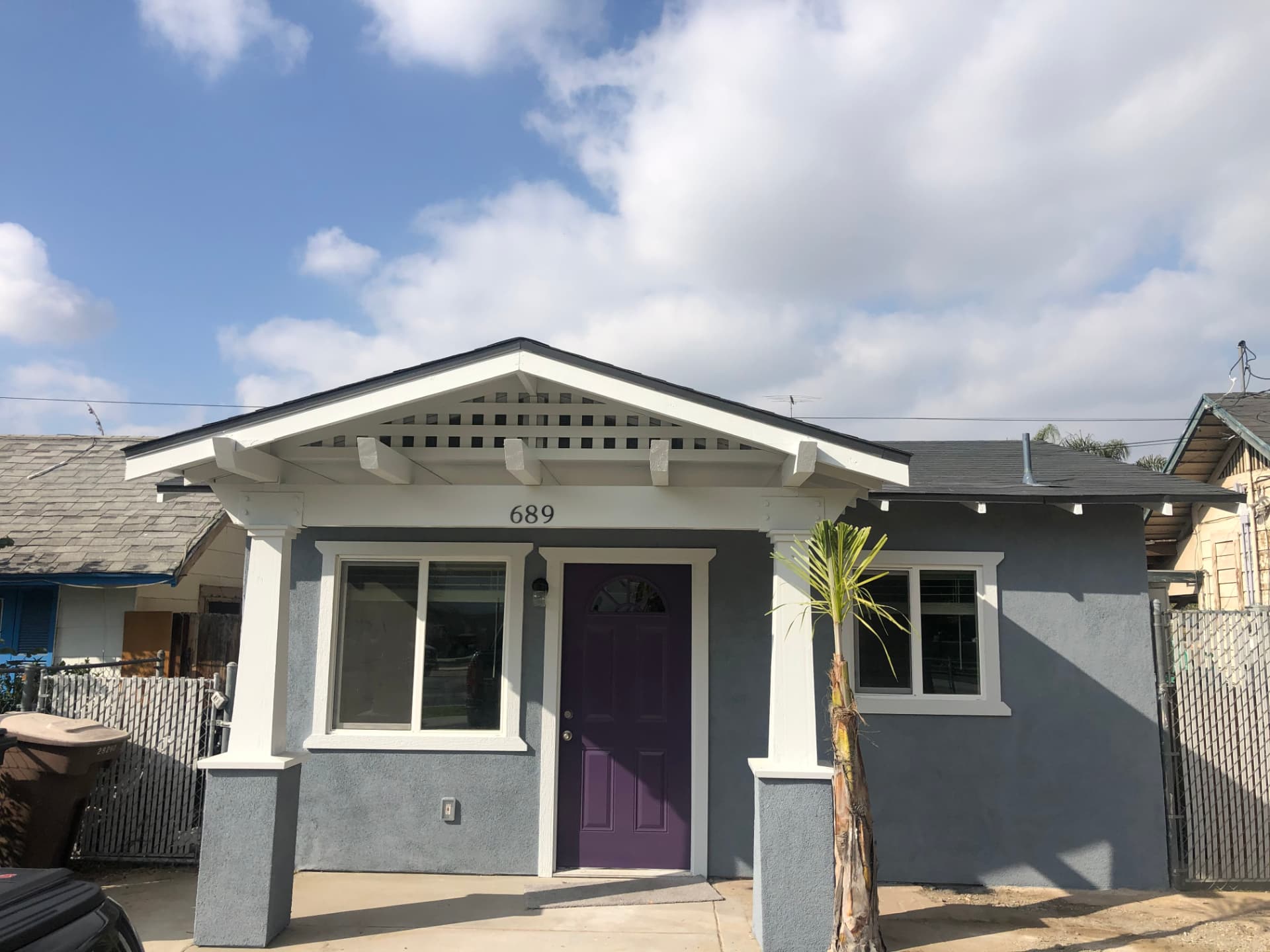 Craftsman cottage with new porch, stucco and windows
