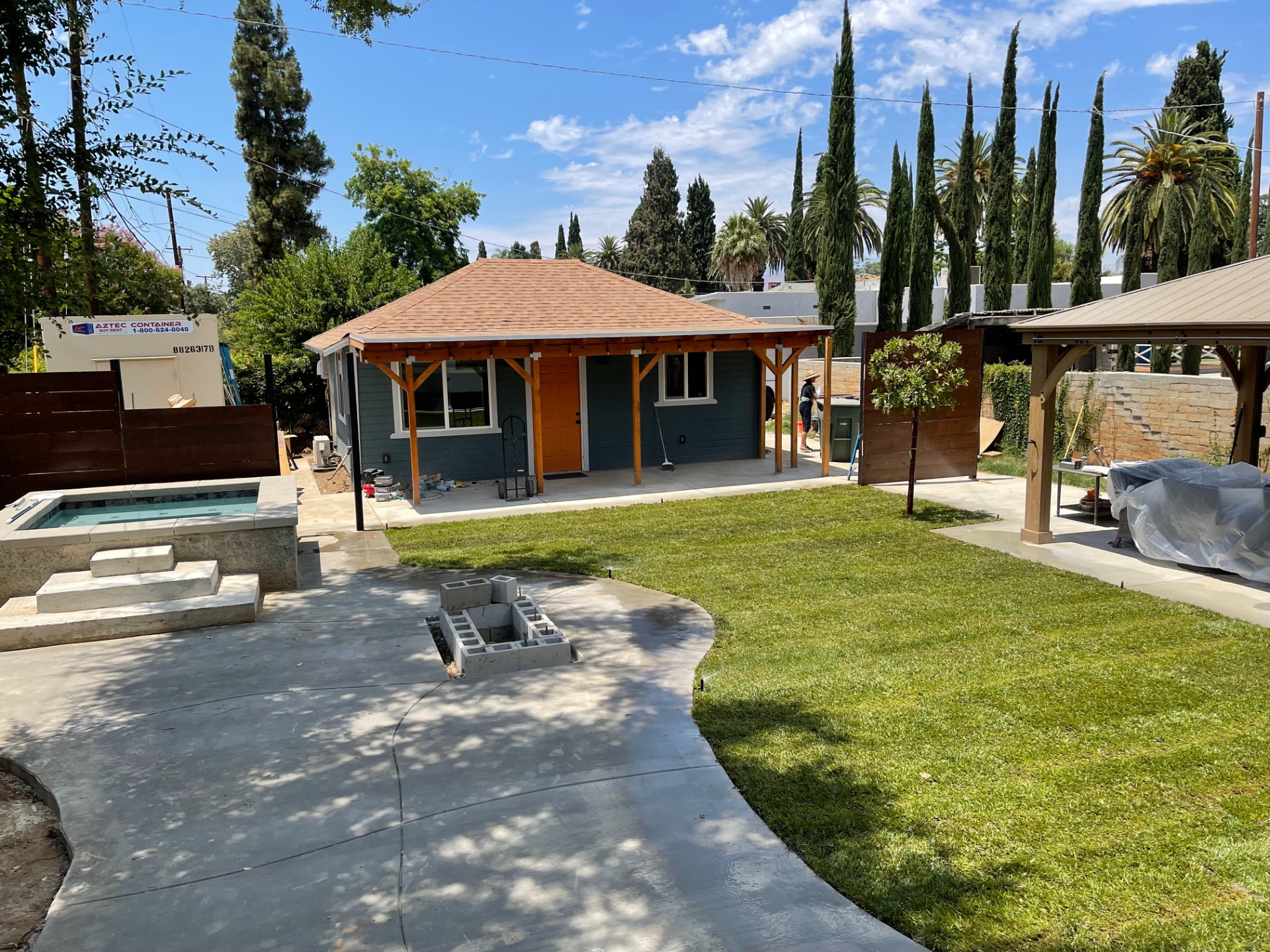 New backyard ADU with timber porch, spa and landscaped lawn